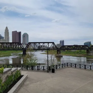 Skyline, river,  and glimpse of umbrella tables to the right.