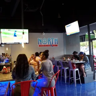 people sitting at the bar