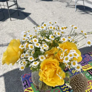 Yellow roses and chamomiles make for a perfect June display.