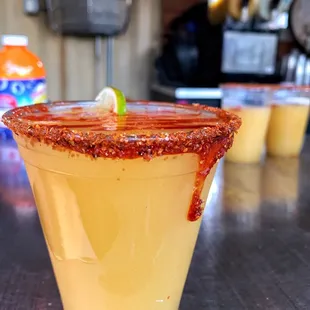 a margarita with a lime garnish on the rim