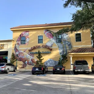 Restaurant is easily recognizable by the yellow exterior with the beautiful mural