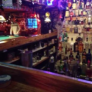 a bar filled with liquor bottles