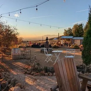 a patio with chairs and tables