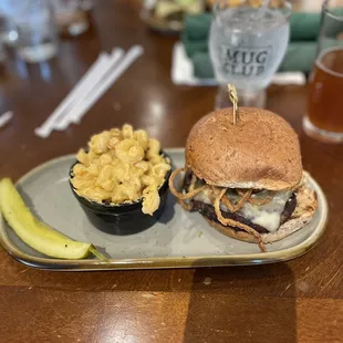 a burger and a side of macaroni and cheese