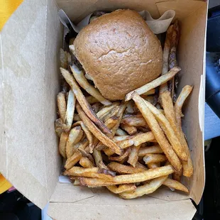 Burger &amp; fries in to-go package.