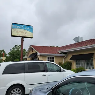 a car parked in front of the restaurant