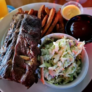 Baby back ribs with slaw and sweet potato fries. You can get mashed potato if you want instead