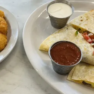 Breakfast quesadilla and tots. Tasty! I still think the eggs Benedict is the best.