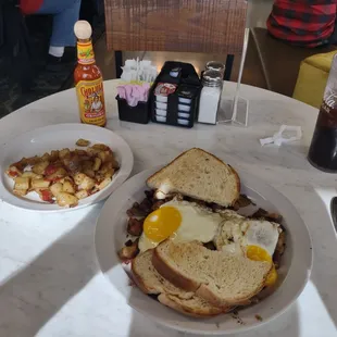 Corned beef hash and eggs with sourdough toast and another side of potatoes just because