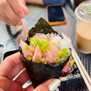 a person eating sushi