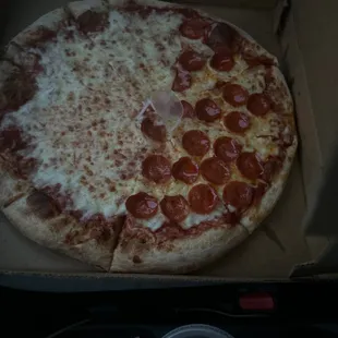 a pepperoni pizza in a box
