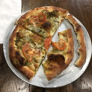 Half eaten Green Monster pizza (delicious and will be finished)