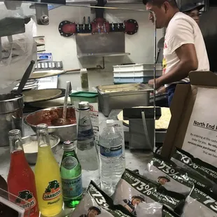 A worker putting all his effort into a single pizza