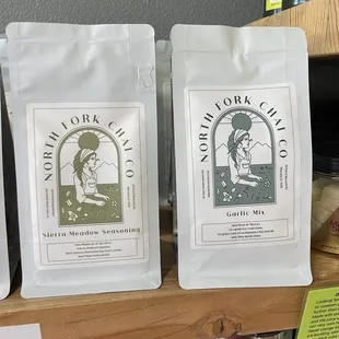 three bags of coffee on a shelf
