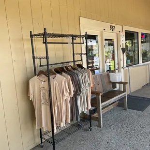 clothes on a rack outside a store
