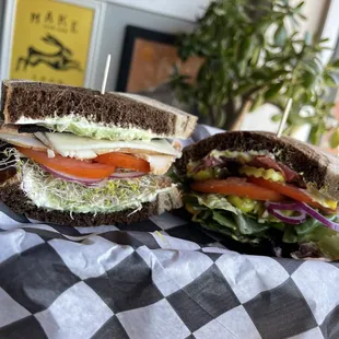 a sandwich with lettuce, tomato, and lettuce