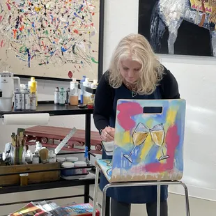 Janetta Smith at work on a chair for the Lynn Institute Chairity Event.