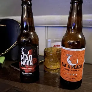 two bottles of beer on a table