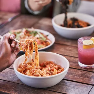 a person eating spaghetti with a fork