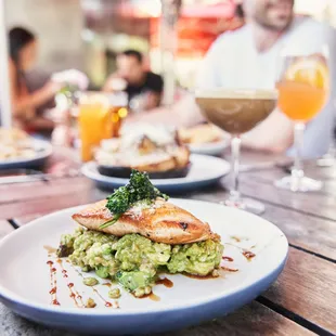 a plate of food and a glass of wine