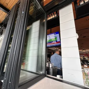 The TV is facing out right where the windows all come together, so you can't see it