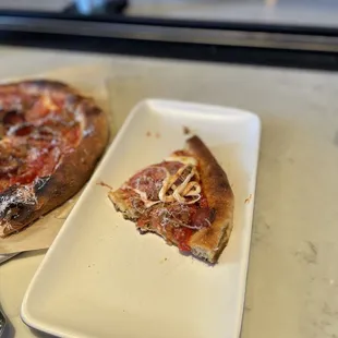 Crispy pizza.  Splitting one for an appetizer is a good portion for each person.  Not a problem unless you are strict about your carbs!