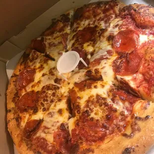 a pepperoni pizza in a box