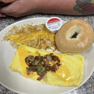 Deluxe omelette with hash brown with cheese and bagel