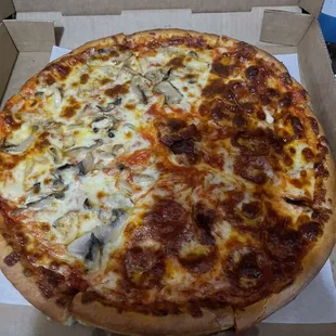 Half mushroom half pepperoni large pizza.