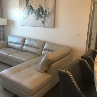 Living room area with back door. Only our 2 bedroom apartments come with a storage on the back patio.