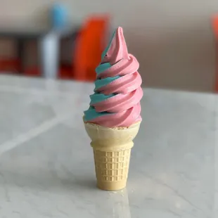 a pink and blue ice cream cone