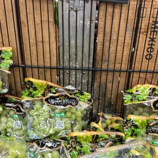 a shopping cart full of grapes
