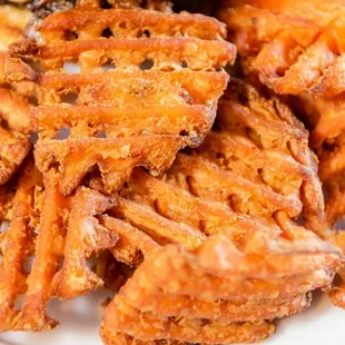 a plate of crispy fried sweet potato fries