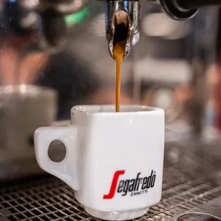 coffee being poured into a cup