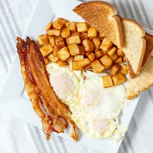 Breakfast Platter with Bacon includes 3 eggs, bacon, home fries, and toast