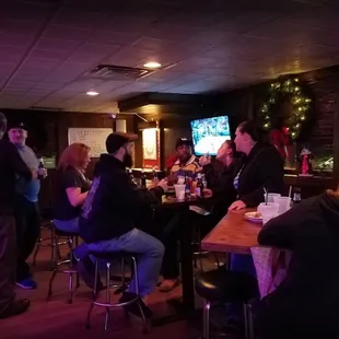 a group of people sitting at a bar