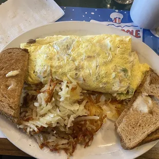 Veggie Omelette made with eggbeaters, hash browns, and wheat toast.