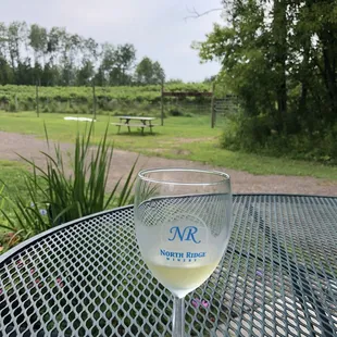 a glass of wine on a table