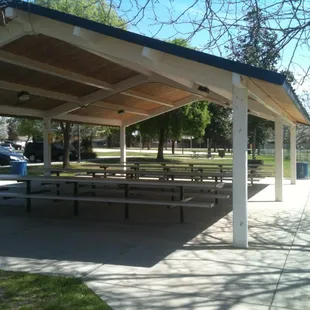 Covered area with picnic tables and barbecue grills