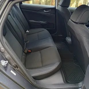Roomy backseat in our Honda electric/hybrid. It seats 3 passengers comfortably.