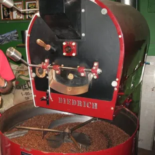 a man roasting coffee beans