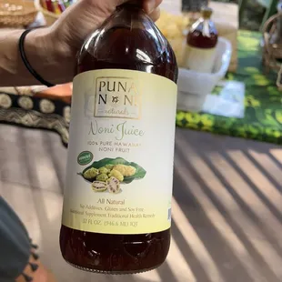 a person holding a bottle