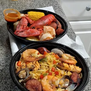two plates of seafood and rice