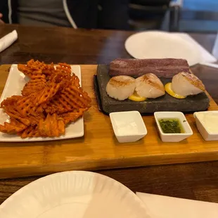 American Kobe and sea scallops on a stone