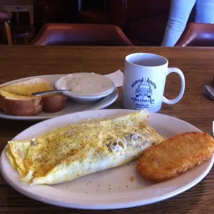 an omelet, bread, and coffee