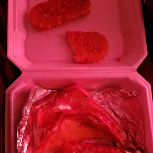 a chicken breast in a styrofoam container