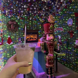 Margarita with cute fireplace table in the background.