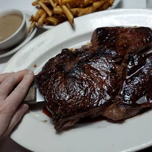 a plate of steak and fries