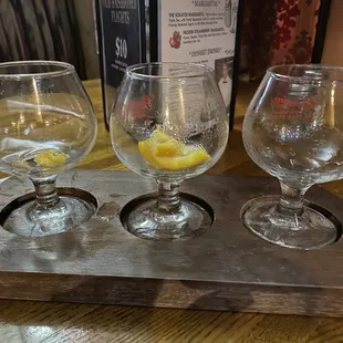 three glasses of wine on a serving tray