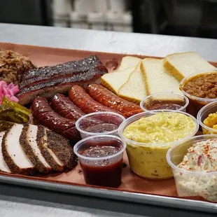 a tray of meat and sides